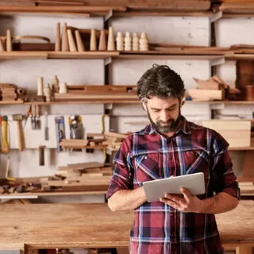 carpenter in front of his woodworking