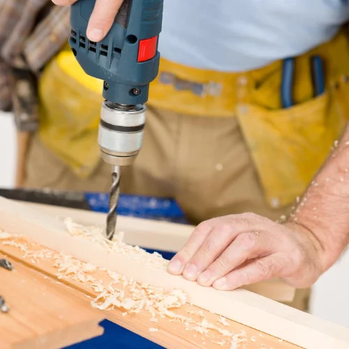 Woodworker using Electric Drill