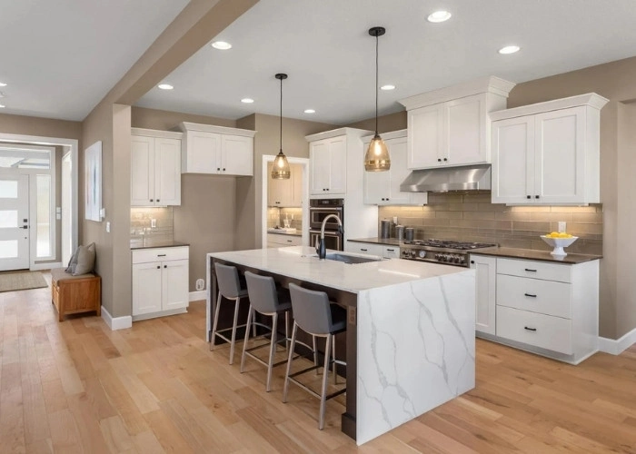 "Modern Kitchen with White Cabinets and Marble Island"
