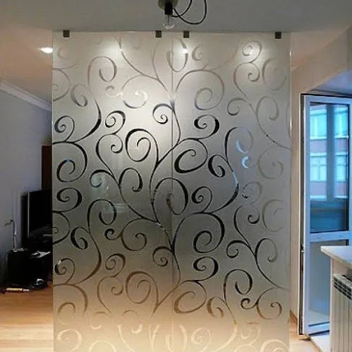 Sandblasted glass partition installed in a Dubai space